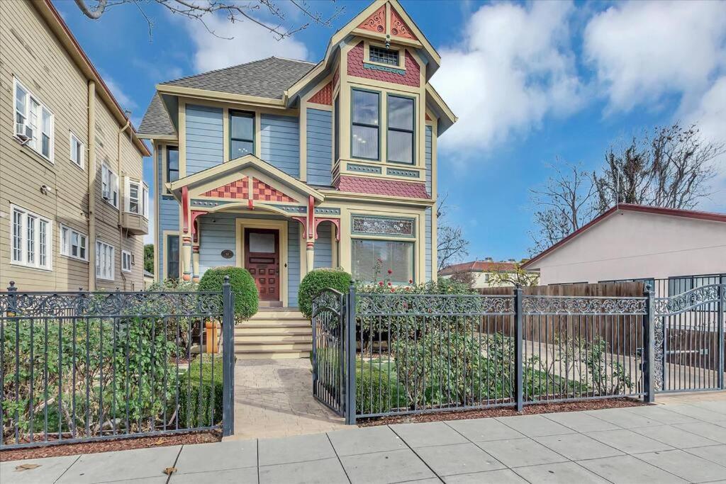 a house with a fence in front of it at Stay In A Piece of San Jose History. in San Jose