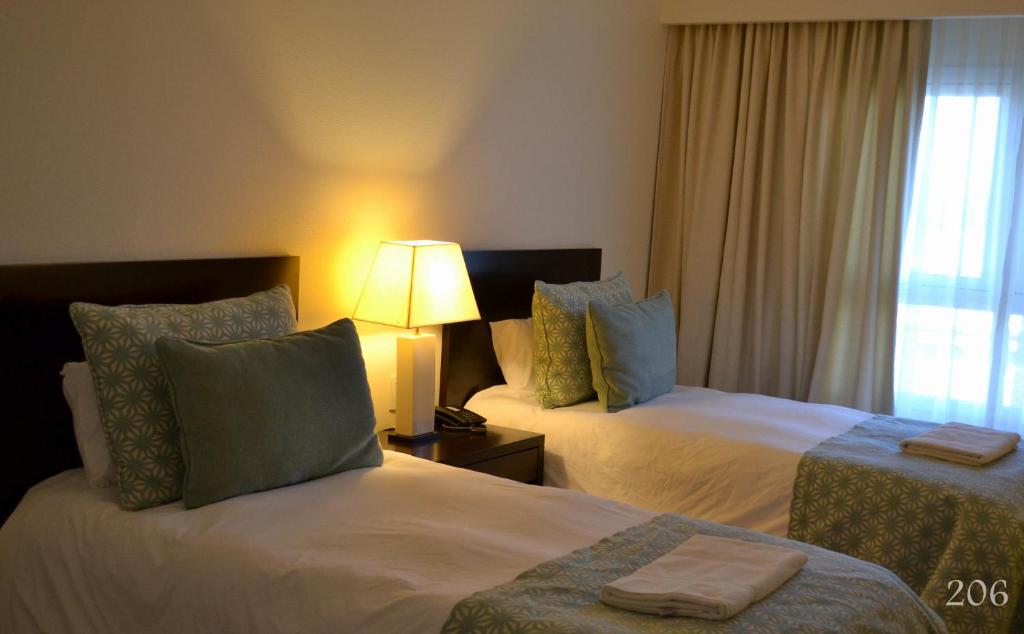 Postel nebo postele na pokoji v ubytování Hotel Quinto Elemento