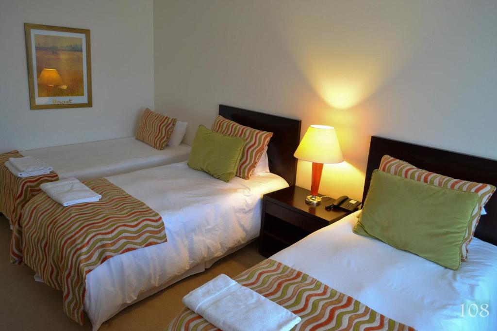 Postel nebo postele na pokoji v ubytování Hotel Quinto Elemento