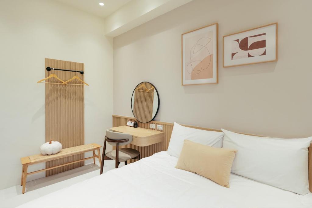 Postel nebo postele na pokoji v ubytování 參穗 SunSui B&B