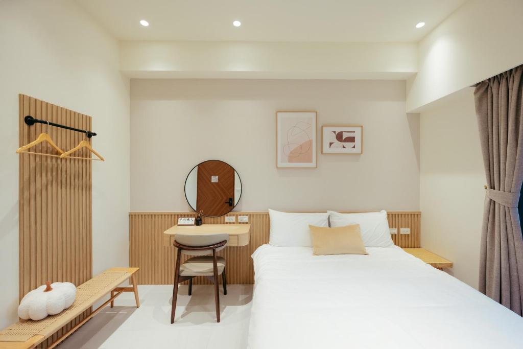 Postel nebo postele na pokoji v ubytování 參穗 SunSui B&B