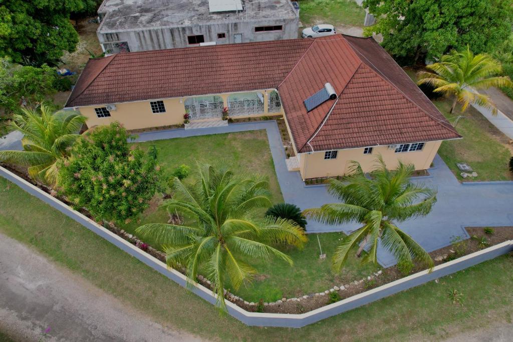 an overhead view of a house with a red roof at Elizabeth Retreat - Island time in Ocho Rios
