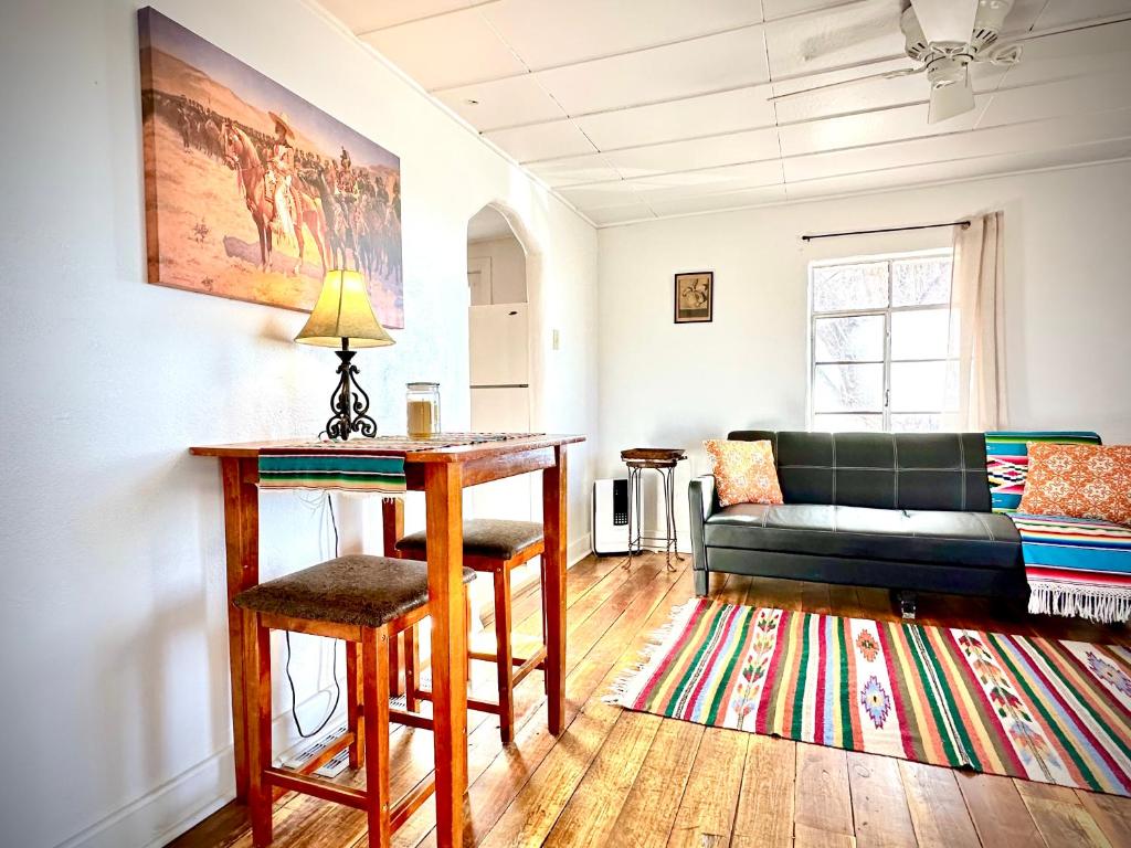 a living room with a couch and a table at The Casita in Raton