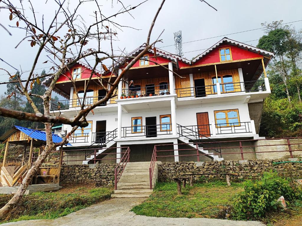 a house with a red and white at Mount View Homestay Sittong in Mangpu