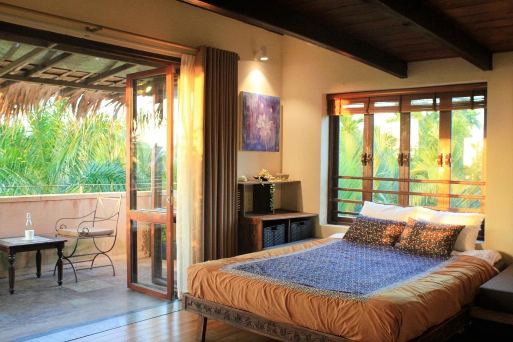 Postel nebo postele na pokoji v ubytování An Villa boutique resort