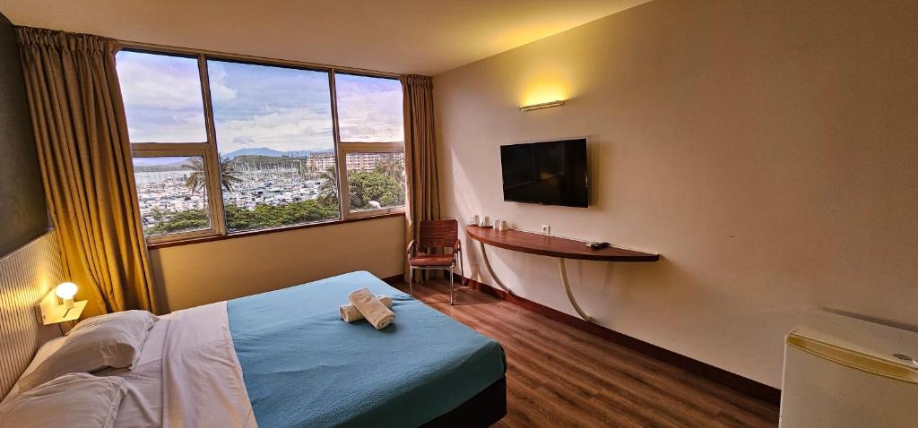 Postel nebo postele na pokoji v ubytování Auberge du MOCAMBO