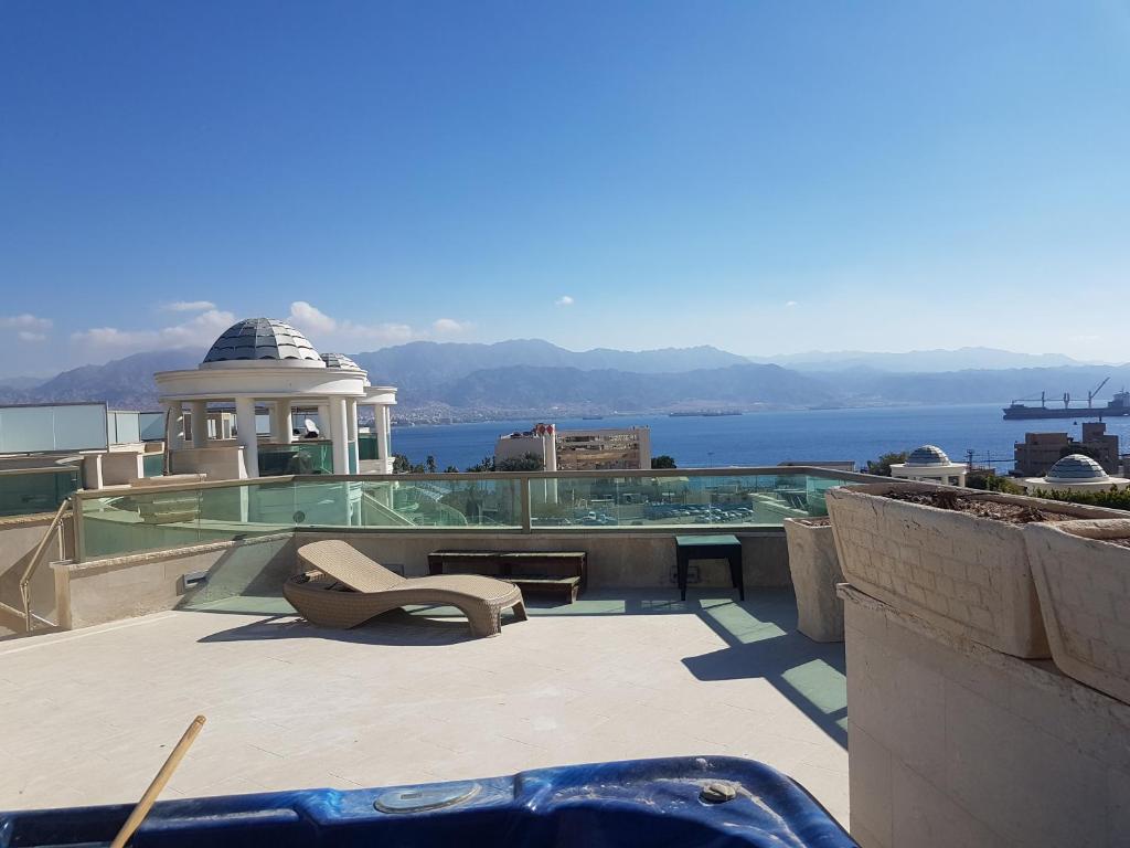 a building with a view of the water at Palmore Top Luxury Resort First line of the Seaside in Eilat