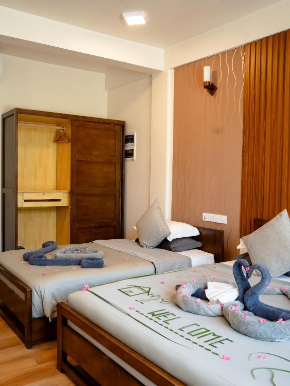 Postel nebo postele na pokoji v ubytování Ahola Thoddoo, Maldives
