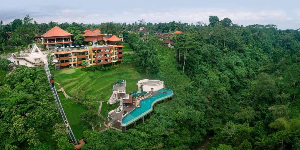 an aerial view of a resort in the forest at Horison Ume Suites & Villas in Ubud