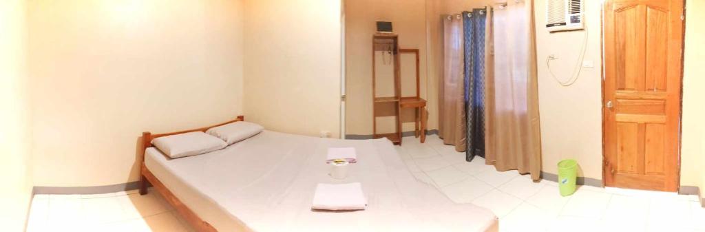 Postel nebo postele na pokoji v ubytování James Homestay