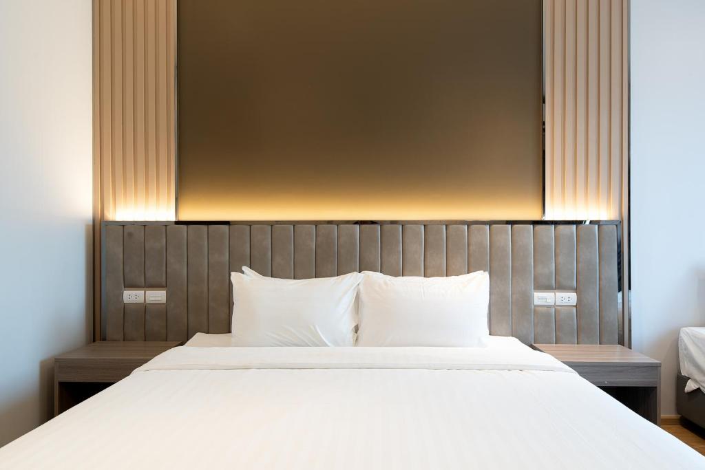 Postel nebo postele na pokoji v ubytování Crystal Srivaree Suvarnabhumi Hotel