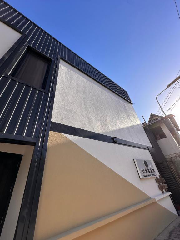 a house with a black roof at Urban Boutique Hotel in Boracay