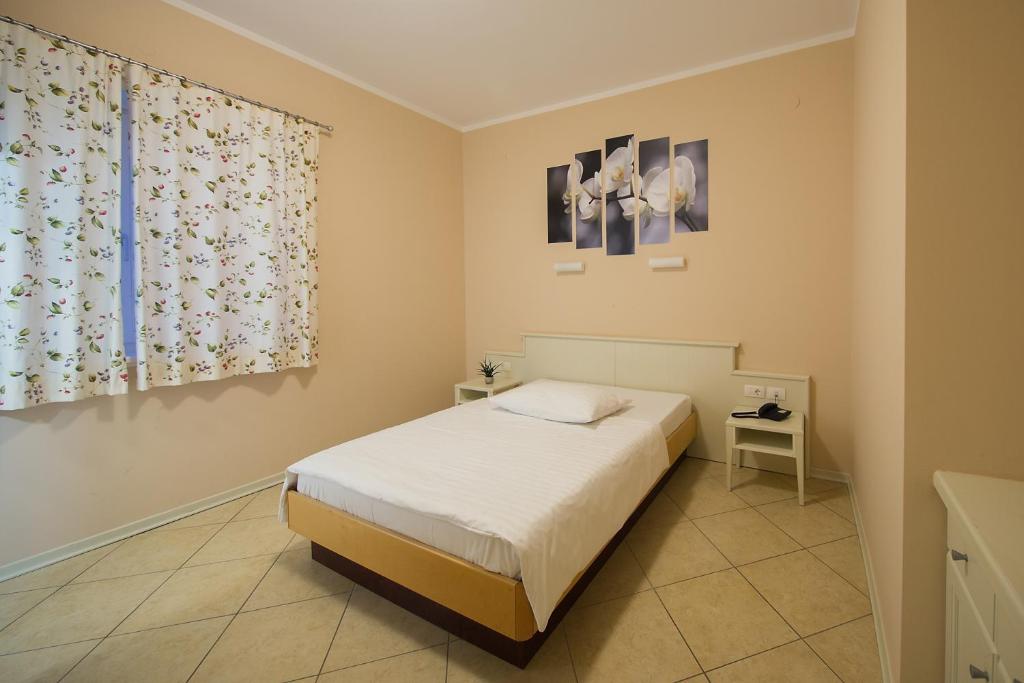 Postel nebo postele na pokoji v ubytování Hotel Kozana