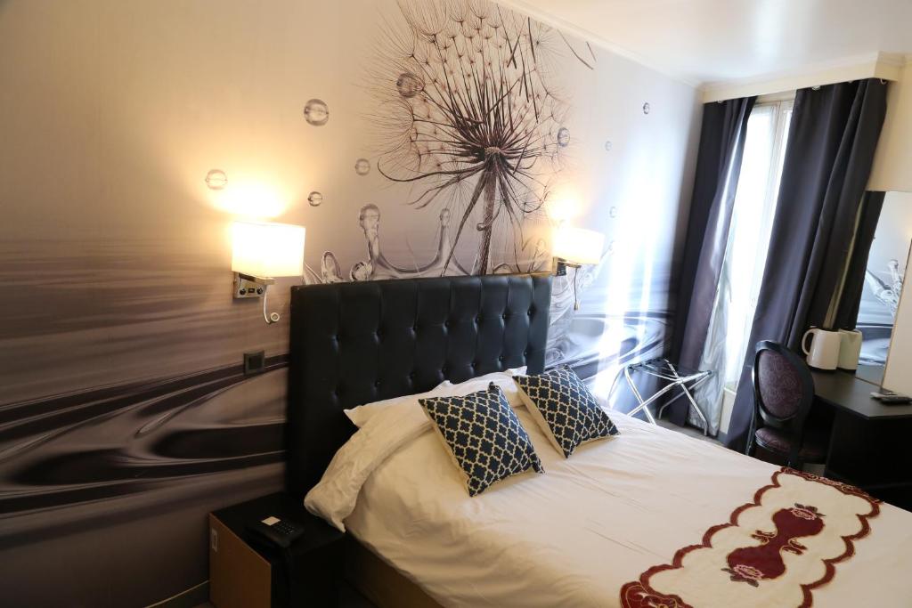 Postel nebo postele na pokoji v ubytování Hôtel Princesse Isabelle
