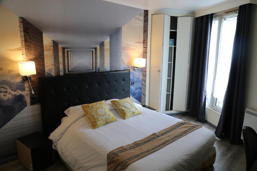 Postel nebo postele na pokoji v ubytování Hôtel Princesse Isabelle