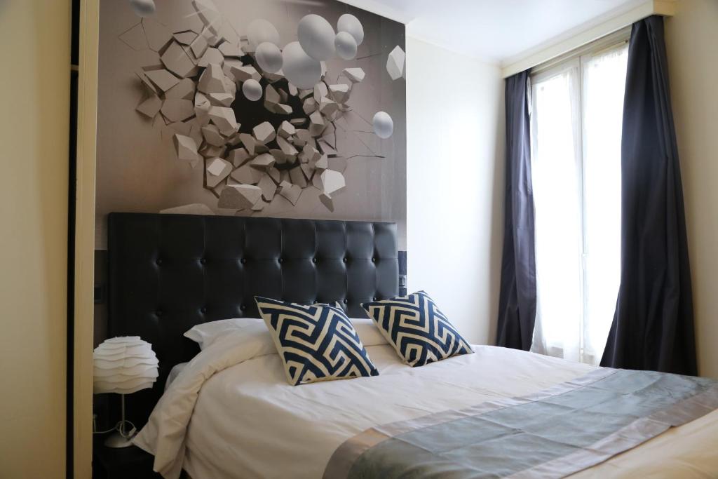 Postel nebo postele na pokoji v ubytování Hôtel Princesse Isabelle