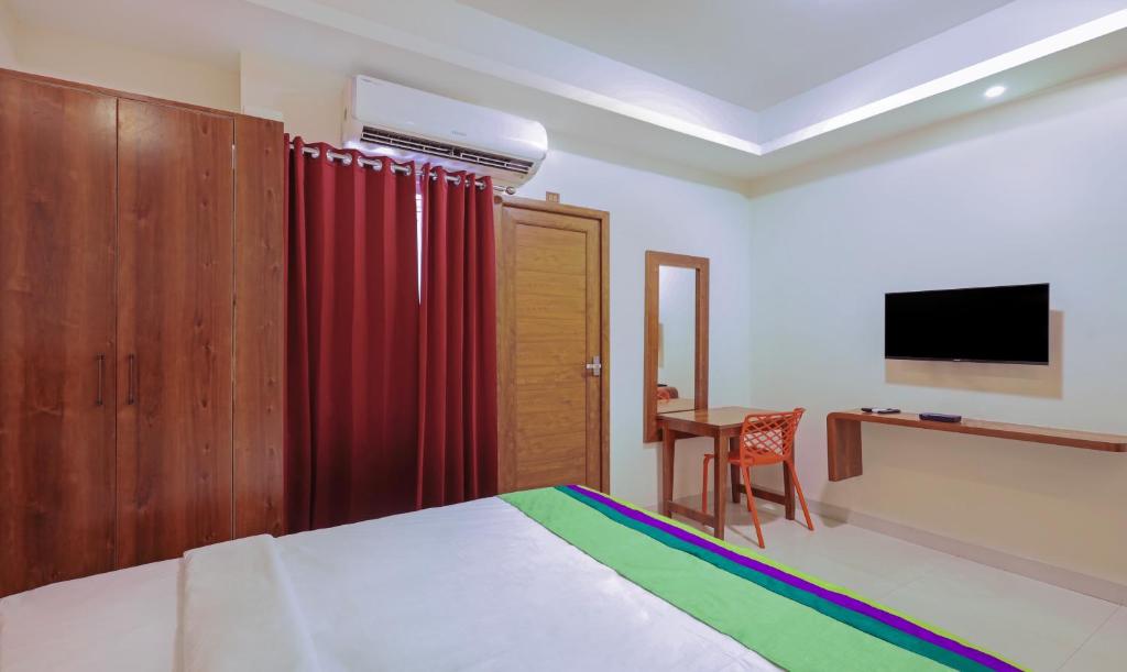 TV a/nebo společenská místnost v ubytování Itsy Hotels Elite Inn