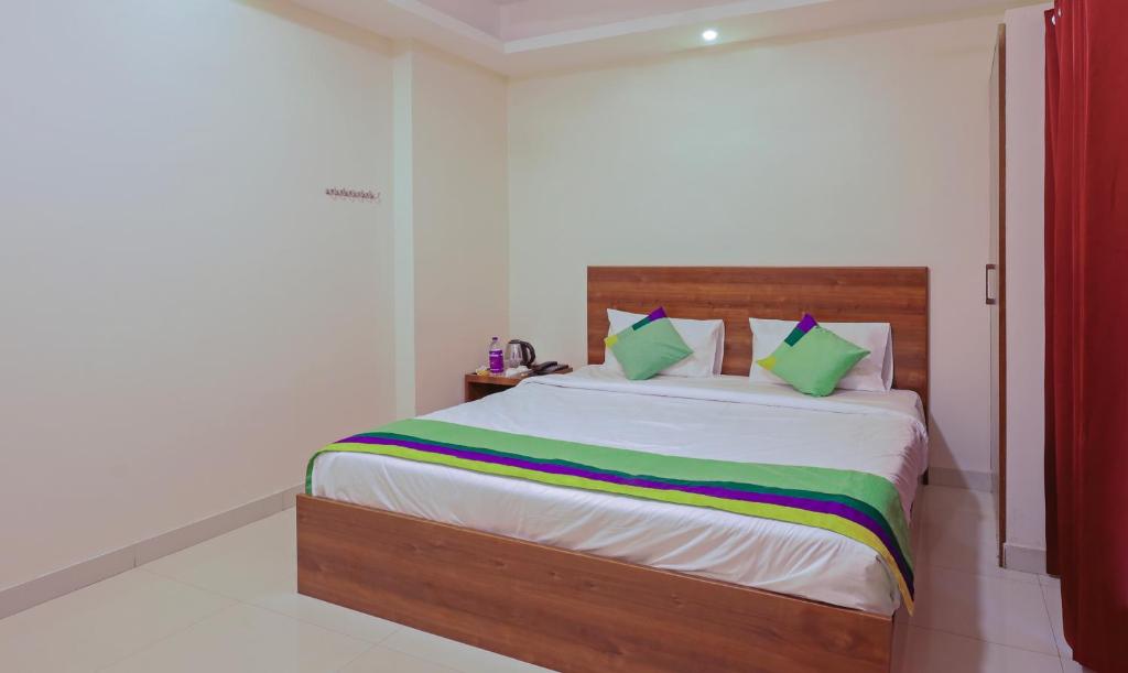 Postel nebo postele na pokoji v ubytování Itsy Hotels Elite Inn