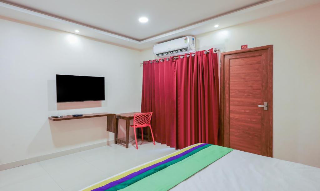 TV a/nebo společenská místnost v ubytování Itsy Hotels Elite Inn