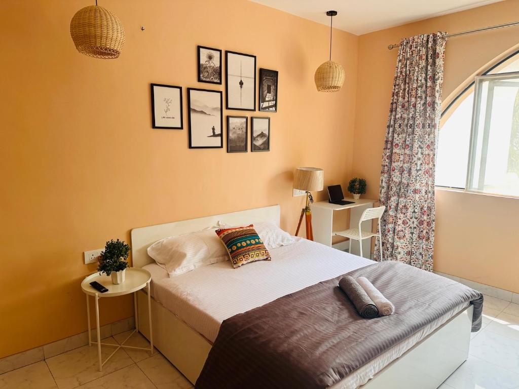 a bedroom with a bed and a window at Poetry: Pvt Studio in Koregaon Park . AC WiFi SmartTv in Pune
