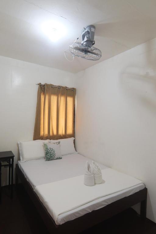 Postel nebo postele na pokoji v ubytování Aloha Hostel Siargao