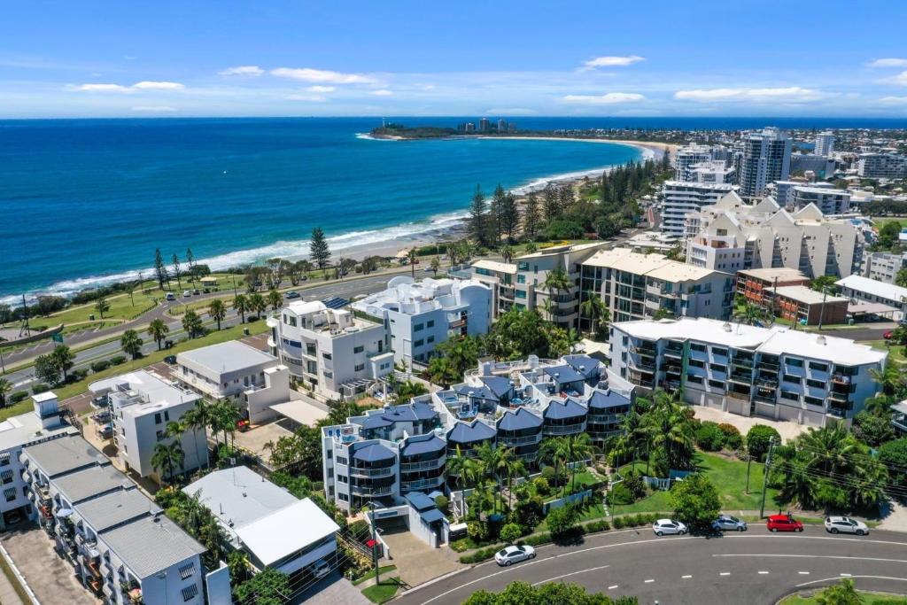 an aerial view of a city and the ocean at Ocean Vista On Alex in Alexandra Headland