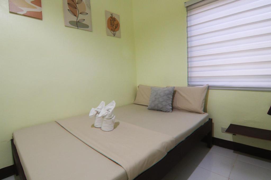 Postel nebo postele na pokoji v ubytování Aloha Hostel Siargao