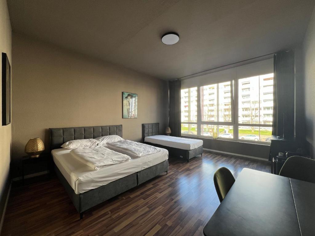 Postel nebo postele na pokoji v ubytování N8 ROOMS - by Leipzig Suites