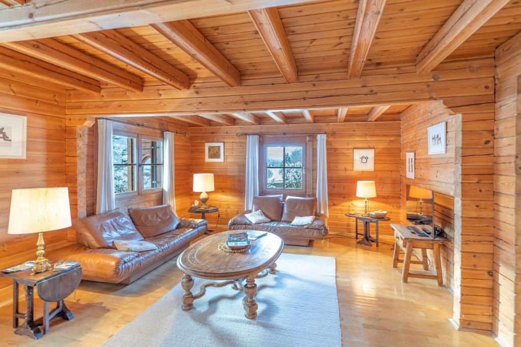 a living room with a couch and a table at Allgäu Nest in Bad Hindelang