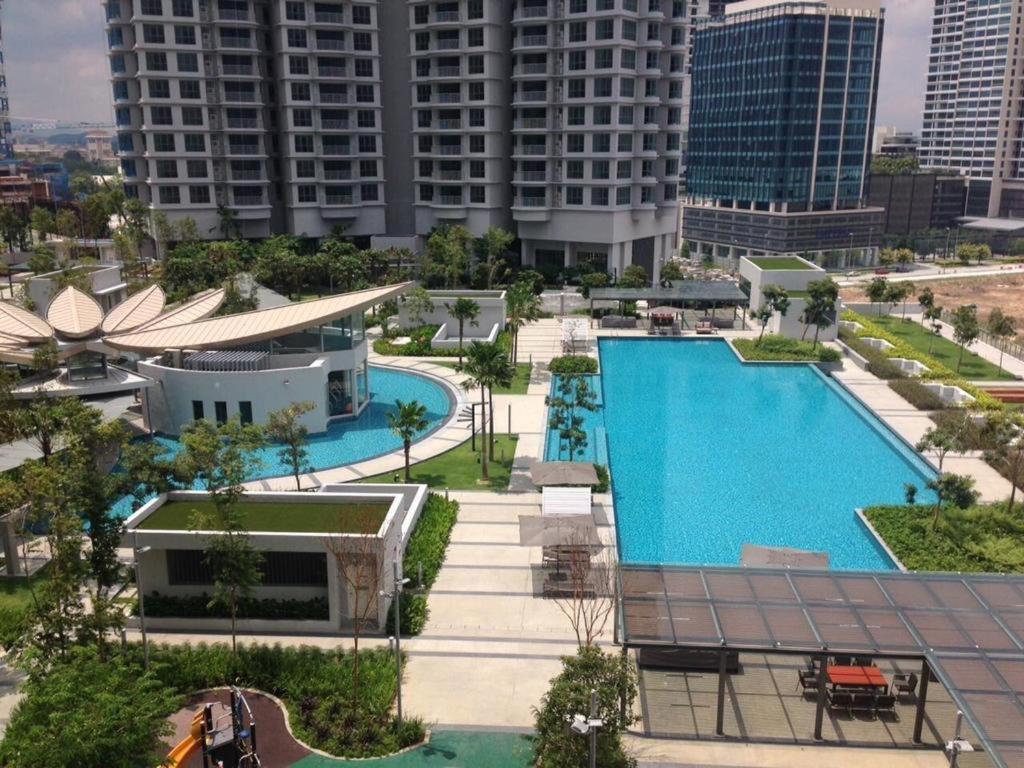 an overhead view of a swimming pool in a city at SG Luxury Condo.(Teega @ Puteri harbor) in Nusajaya