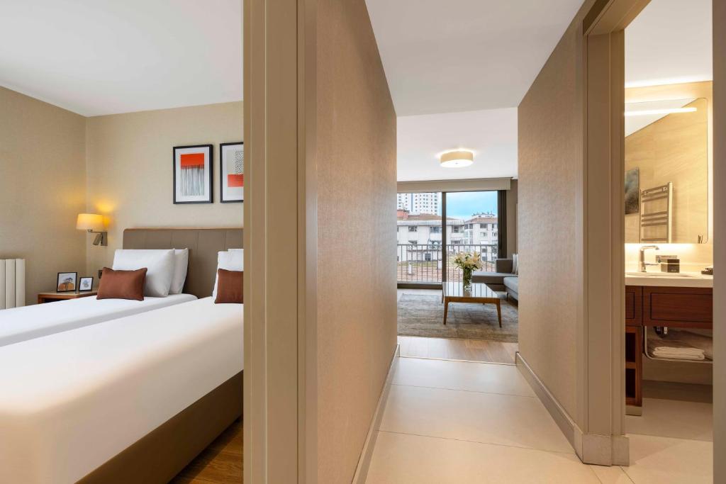 Postel nebo postele na pokoji v ubytování Tzl Suites Hotel Nişantaşı