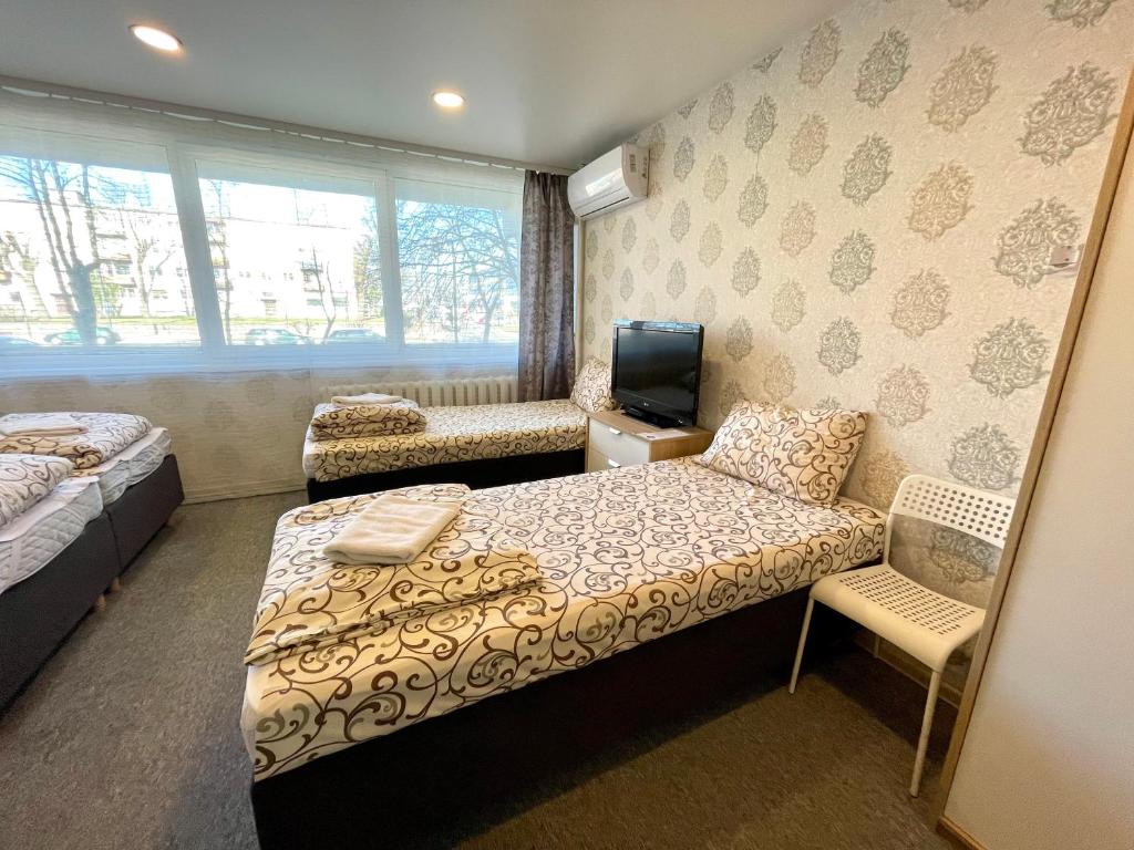 Postel nebo postele na pokoji v ubytování Savan House "Easy Kaunas"