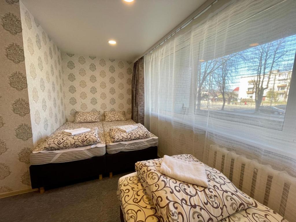Postel nebo postele na pokoji v ubytování Savan House "Easy Kaunas"