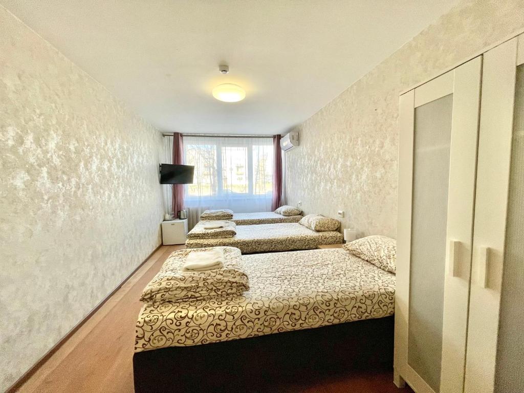 Postel nebo postele na pokoji v ubytování Savan House "Easy Kaunas"
