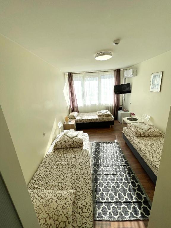 Postel nebo postele na pokoji v ubytování Savan House "Easy Kaunas"