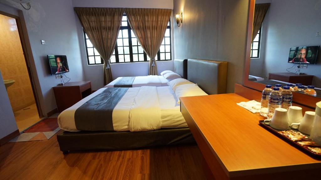 Postel nebo postele na pokoji v ubytování Zen Zeng Hotel