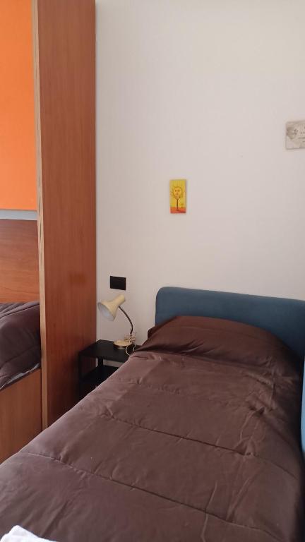 Łóżko lub łóżka w pokoju w obiekcie Pitagora