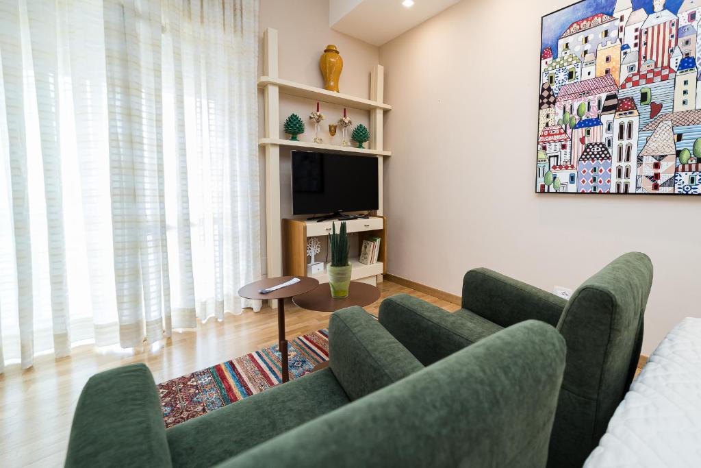 TV a/nebo společenská místnost v ubytování GoodStay Cianci Luxury Room