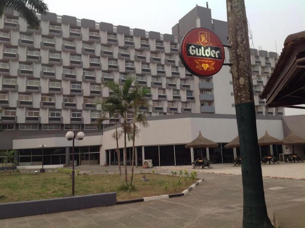 a hotel sign in front of a large building at Imo Concorde Hotel in Owerri