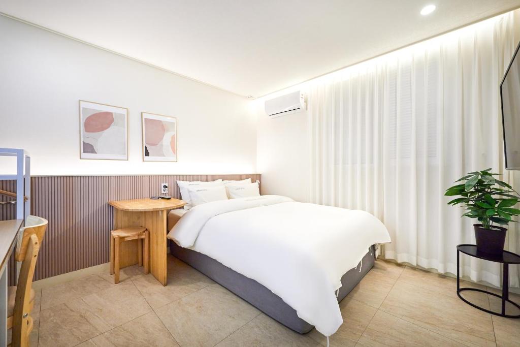 Postel nebo postele na pokoji v ubytování Urban Hotel