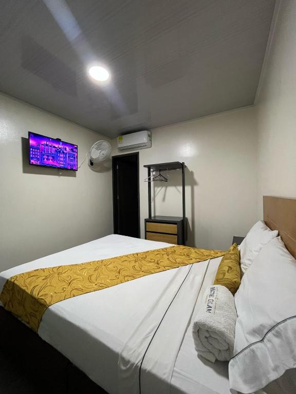 Postel nebo postele na pokoji v ubytování Hotel Olam Confort