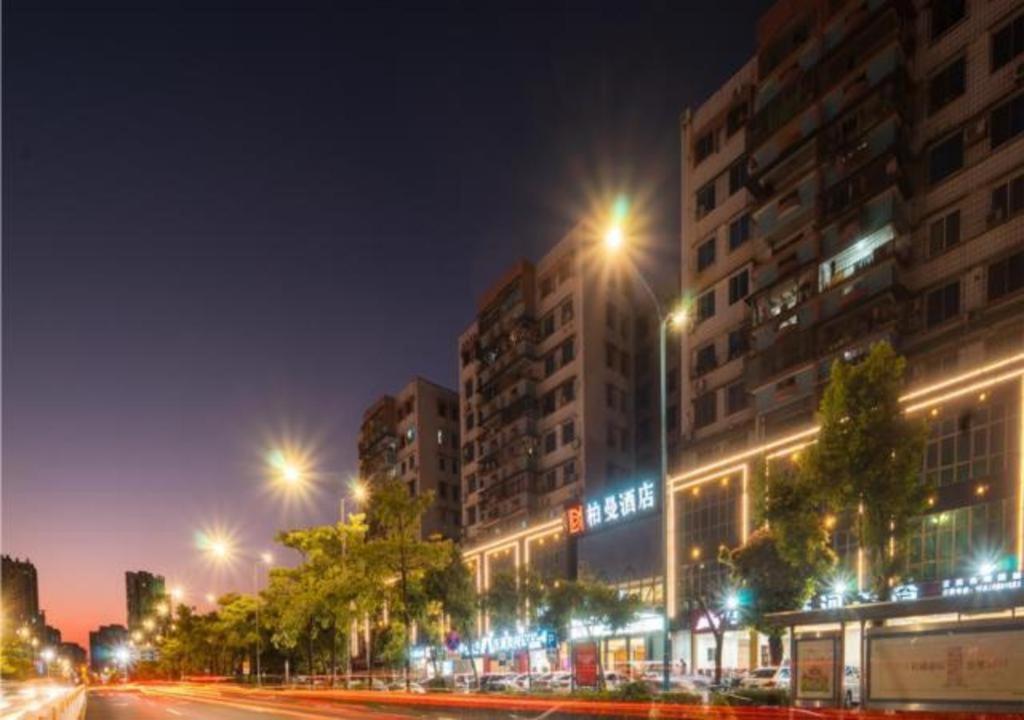 a city street at night with buildings and street lights at Borrman Hotel Qingyuan Shunying Gymnasium Flagship in Qingyuan