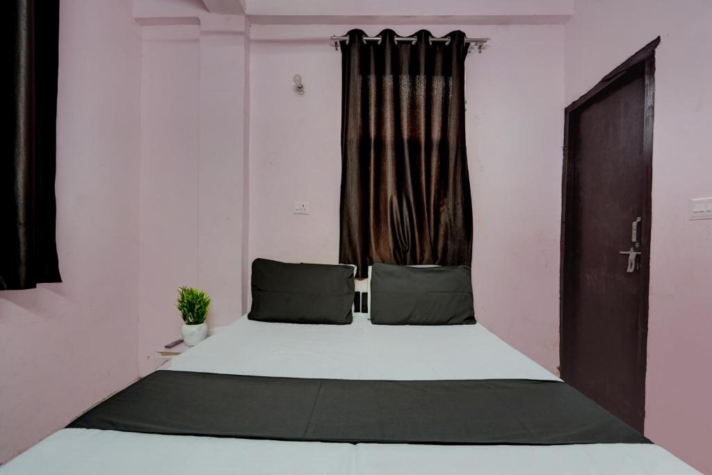 Voodi või voodid majutusasutuse OYO Cozy Home toas