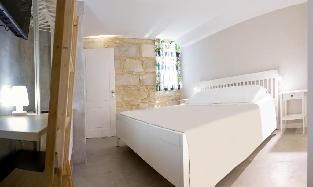 Postel nebo postele na pokoji v ubytování Le Sirene B&B