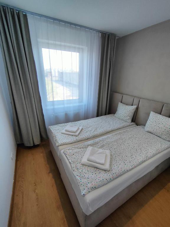 Postel nebo postele na pokoji v ubytování Fanea Residence