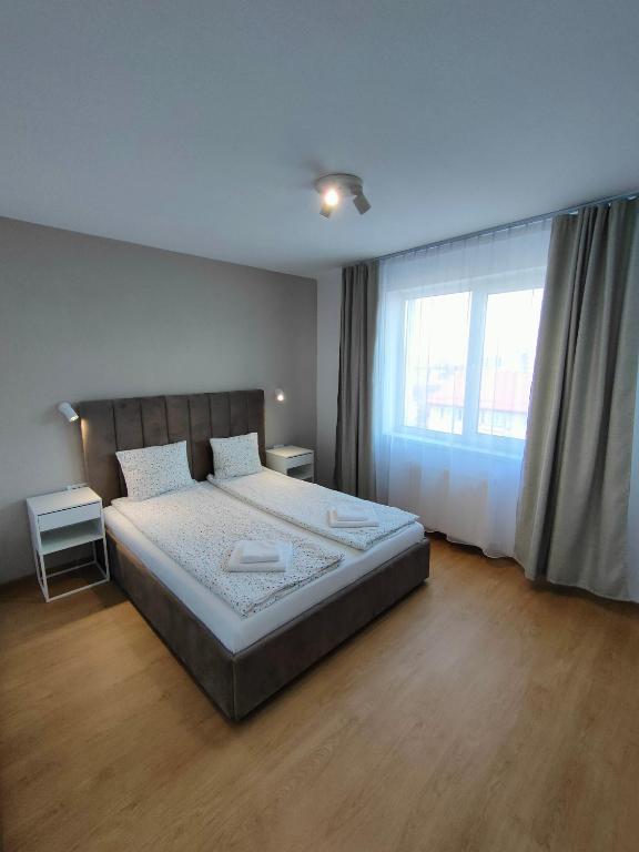Postel nebo postele na pokoji v ubytování Fanea Residence
