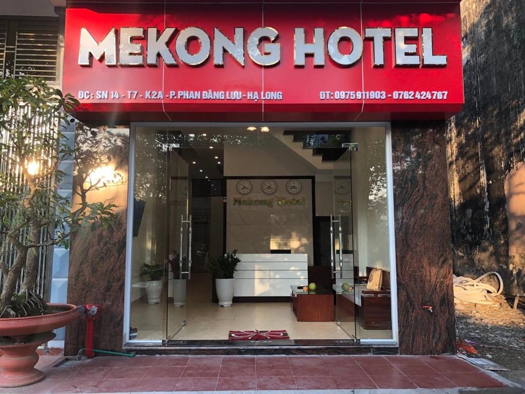 a mekong hotel with a red sign on the facade at Hotel Me Kong in Ha Long