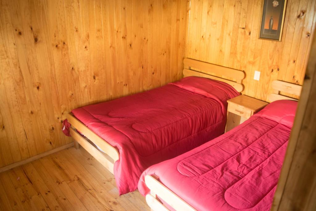 Postel nebo postele na pokoji v ubytování Mae Joa Turismo - Cabañas & Camping Familiar