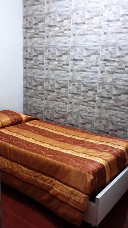 Postel nebo postele na pokoji v ubytování Hotel Pradera Verde Inn