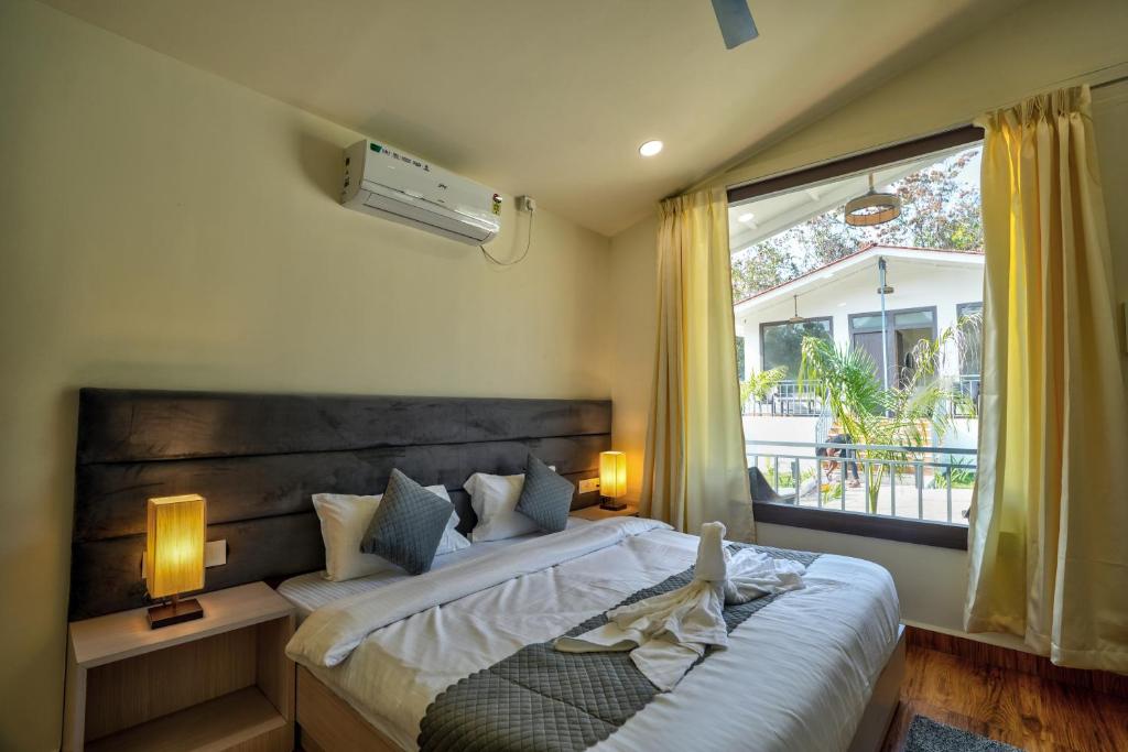 Postel nebo postele na pokoji v ubytování Amore Serenity Resort